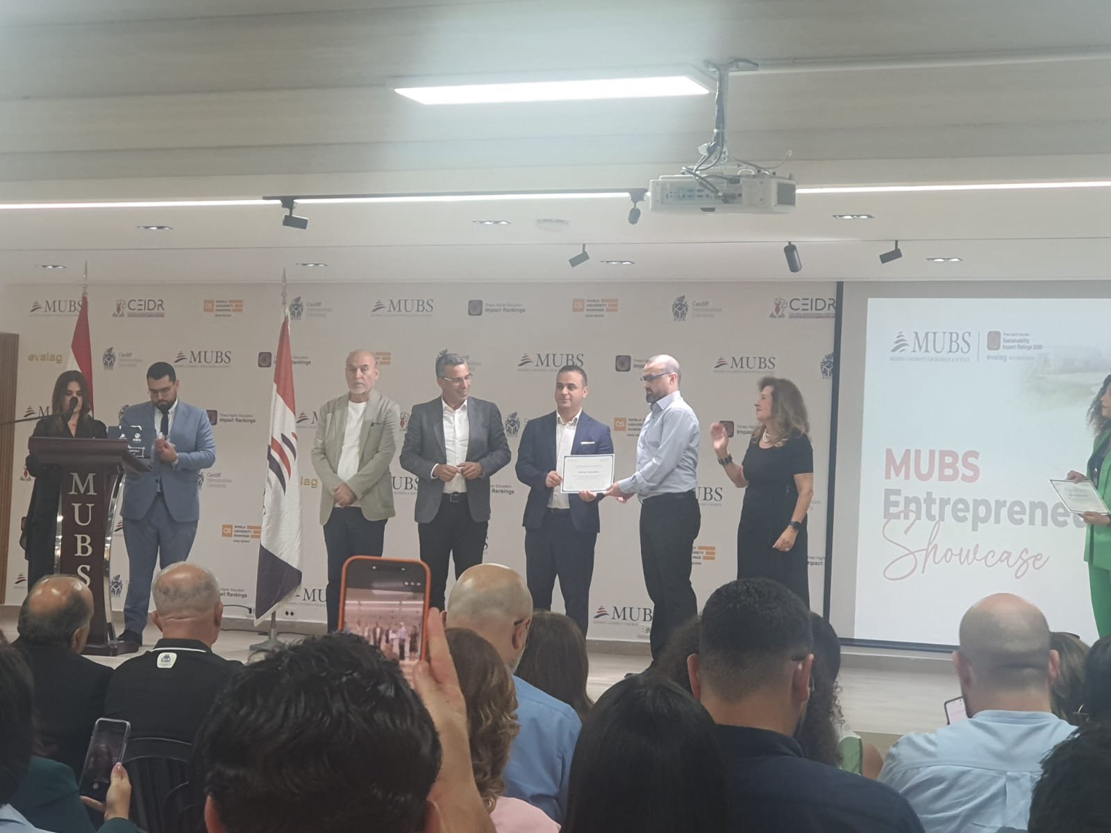 Certificate presentation at the MUBS Entrepreneurs Showcase